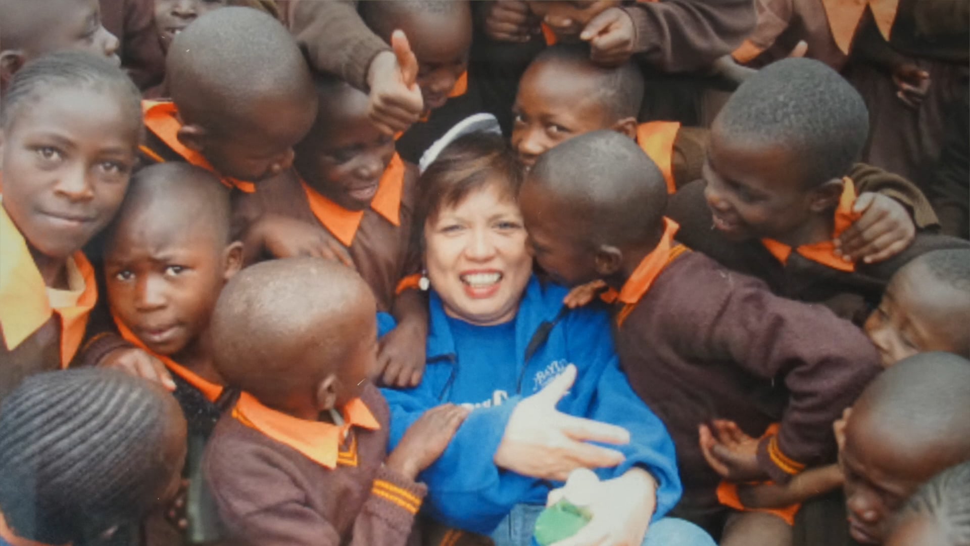 Susie Jennings washing feet at an Operation Care International Christmas Gift event