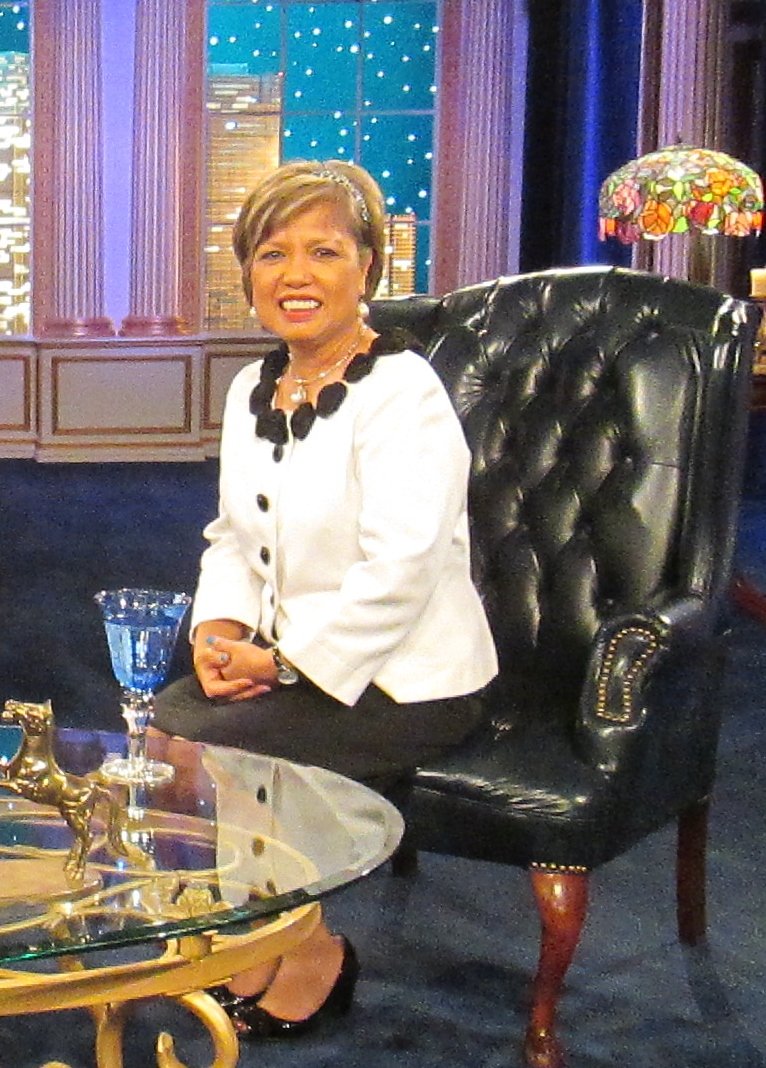 On set black chair white dress business suit dress